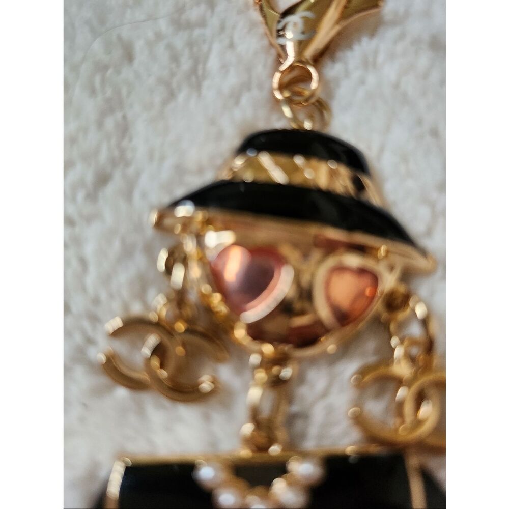 CHANEL Black and Gold Enamel Charm Doll with Pink Heart Sunglasses - Picture 4 of 7